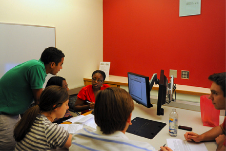 Students at Wharton playing a collaborative and competitive multiplayer simulation