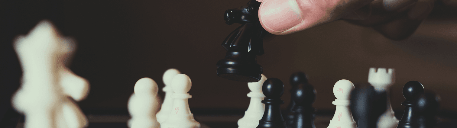 Chess board with person moving a piece