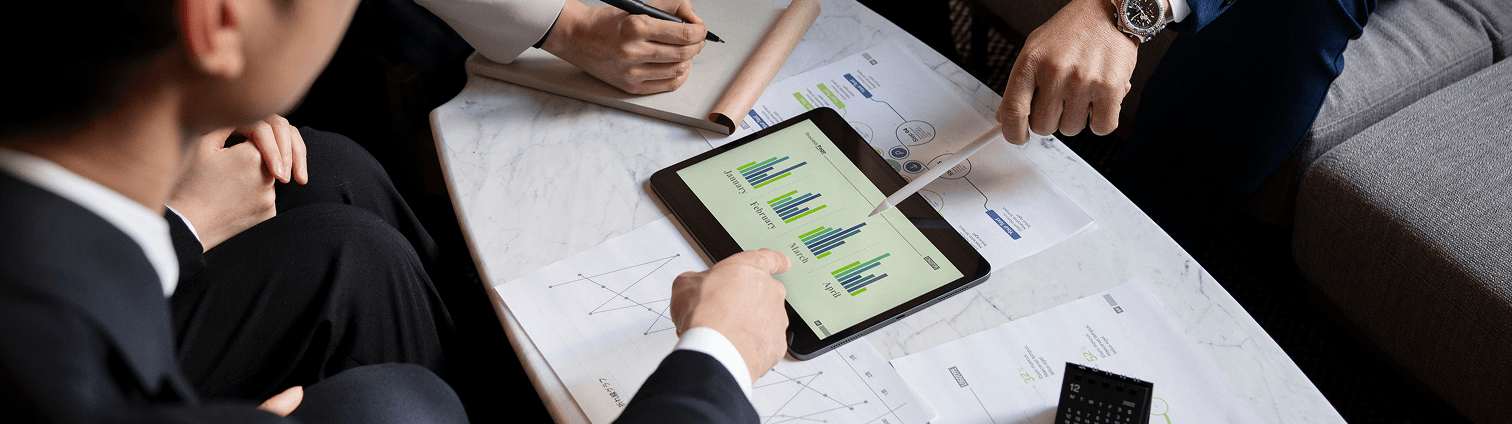 sales person pointing at tablet