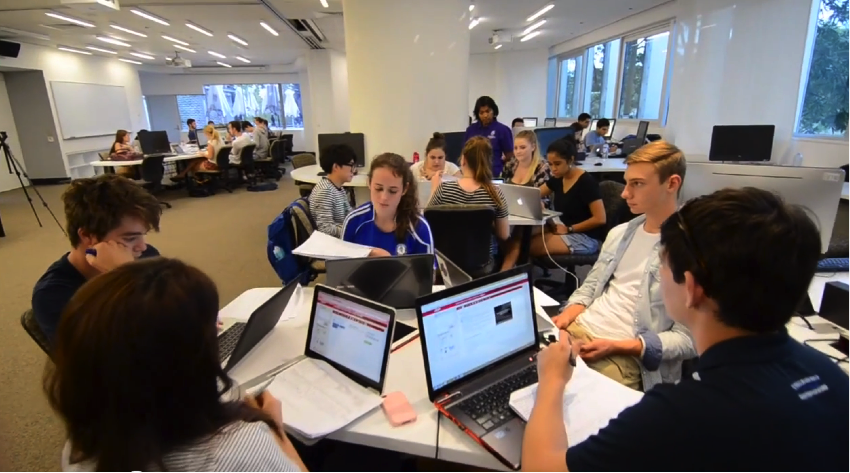 Students using Harvard Business School Everest Teamwork and Leadership Simulation