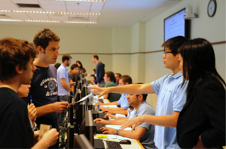 Students at Wharton playing a collaborative and competitive multiplayer simulation